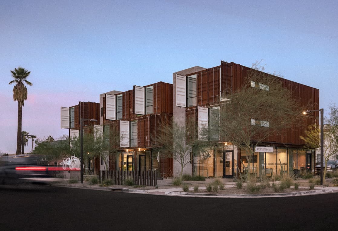 Oscar standing in a commercial Arizona real estate setting